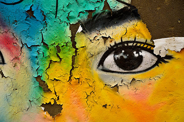 istock Colorful texture with nice eye on rough and cracked wall 174397975