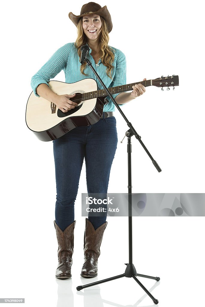 若い女性がギター - カウガールのロイヤリティフリーストックフォト