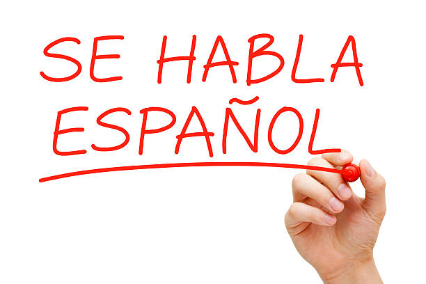 Spanish Spoken Hand writing Se Habla Espanol with red marker on transparent wipe board. bilingual stock pictures, royalty-free photos & images