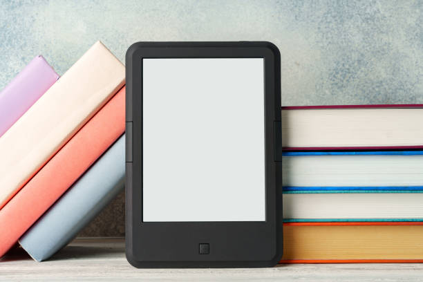 istock Digital tablet with a stack of books on gray background 1743997627