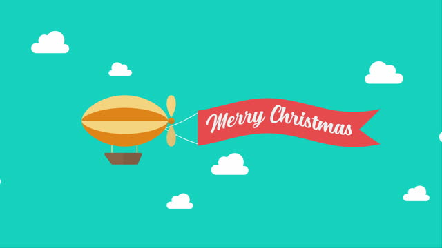 Airship pulls the banner with word MERRY CHRISTMAS on it
