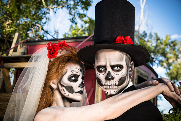 istock Characters: Skeleton bride wraps arms around groom. Spooky Halloween wedding. 174402282