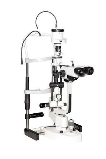 The precision LED digital slit lamp optimizes the clinical space for eye care professionals. Isolated against a white background.