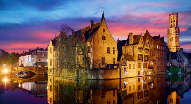 istock Bruges, Belgium. Evening sunset with blue sky. Water channels of 1744040142