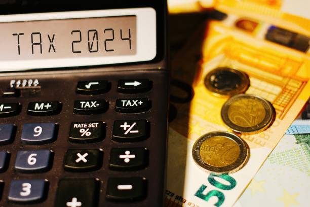 istock Calculator with the text tax 2024 on display . 1744046470