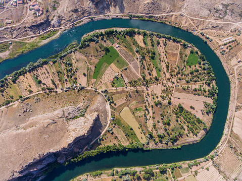 The Kızılırmak River passing through a settlement near Avanos in the Cappadocia region of Turkey.