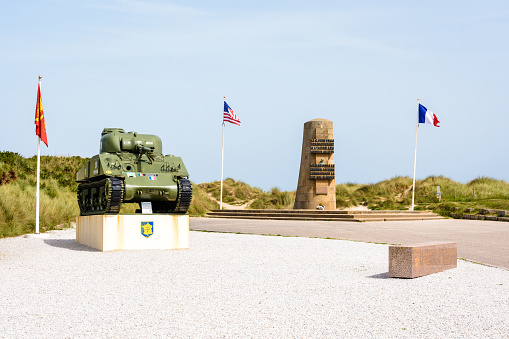 Saint-Martin-de-Varreville, France - Sept. 6, 2023: A Sherman tank in front of the memorial to the landing of the Allied forces and French 2nd Armored Division of General Leclerc at Utah Beach.