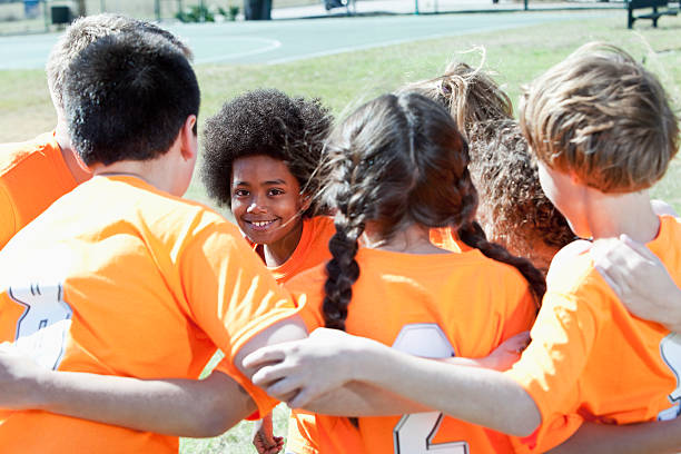 istock Coach with children's sports team 174407437