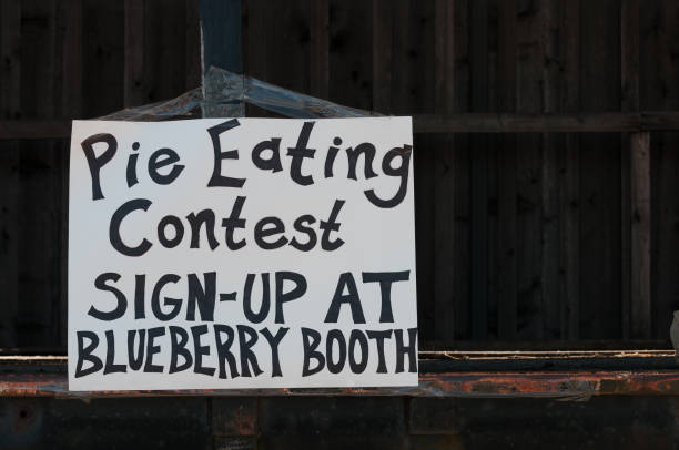 Handmade sign for a blueberry pie eating contest at a country fair.