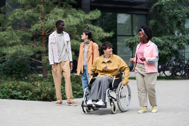 istock Man with disability walking with his friends 1744103720