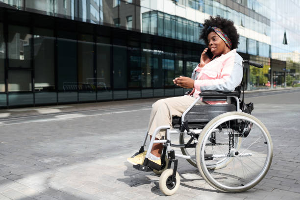 istock Woman with disability talking on the phone 1744119985