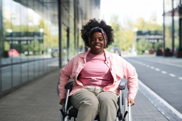 african american woman with disability - physical impairment wheelchair disabled accessibility imagens e fotografias de stock