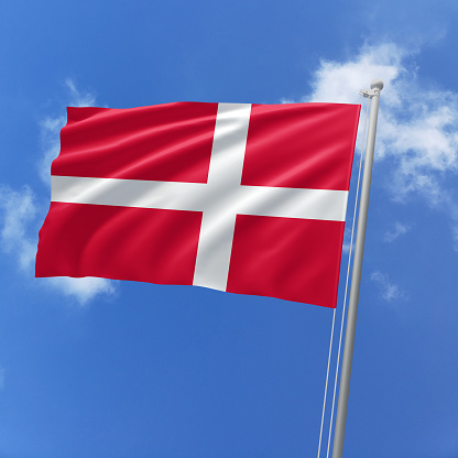 English flag in cloudy sky. Panoramic view and large copy space.