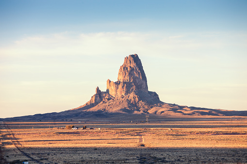 View of Agathla Peak in light of the setting sun, south of Monument Valley, Arizona, United States.