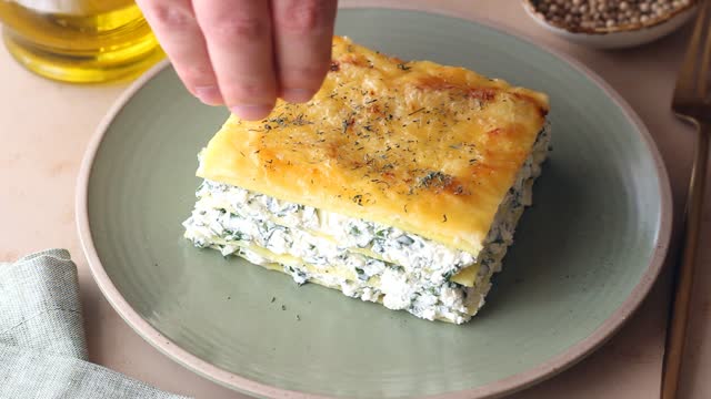 Lasagna with cheese and spinach. Italian food. Vegetarian food.