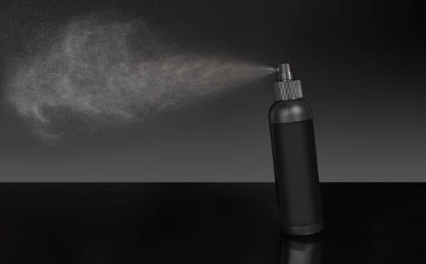 istock Black cosmetic bottle spraying liquid, on black background 1744170400