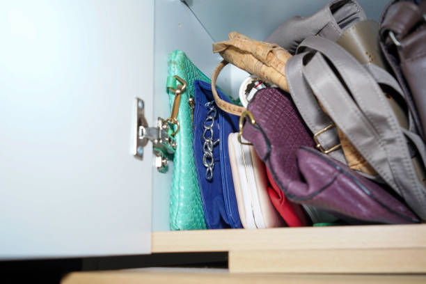 istock Wardrobe overflowing and colorfully mixed with jackets and pants, sweaters 1744173477