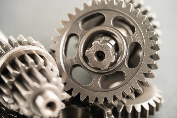 istock Gear and cogs wheels, clock mechanism, brass metal engine industrial. 1744173998