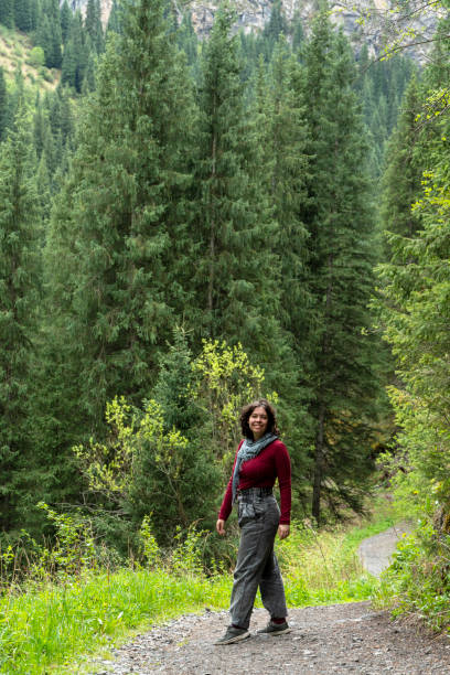 istock A young woman hiking through a mountain forest 1744176792