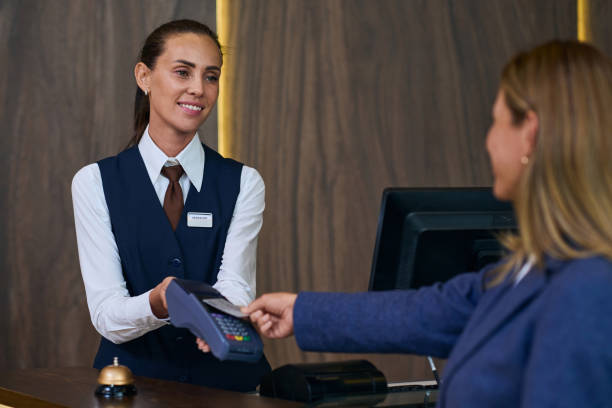 istock Receptionist registrating guest in the hotel 1744189079