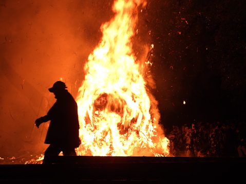 Toba fire festival . february 2020, Nishio city. Silhouette   of elderly festival security guard