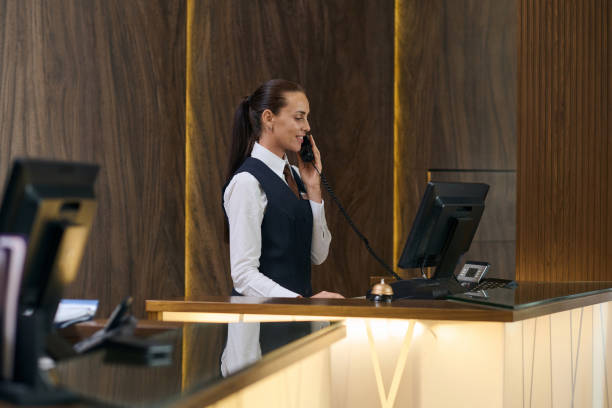 istock Manager booking a room by the phone 1744195573