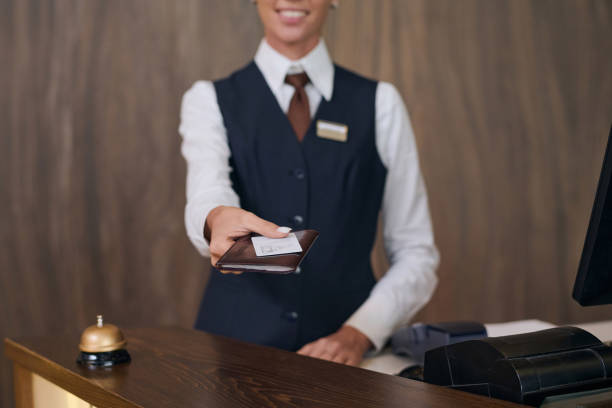 istock Receptionist giving key from the room in hotel 1744196738