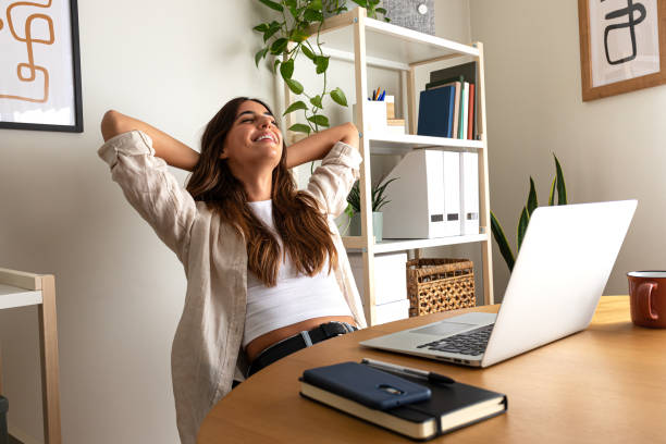 istock Happy young caucasian entrepreneur relaxing at home office taking a break feeling satisfaction. 1744207690