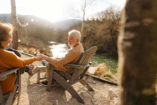 istock Senior couple enjoy sunset over the river together 1744215954