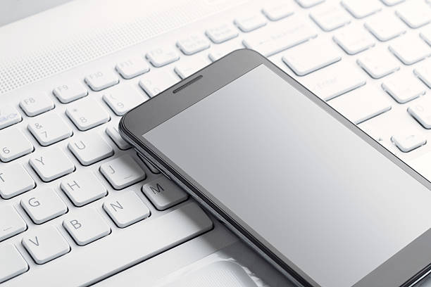 istock Modern smart phone on the laptop 174422924