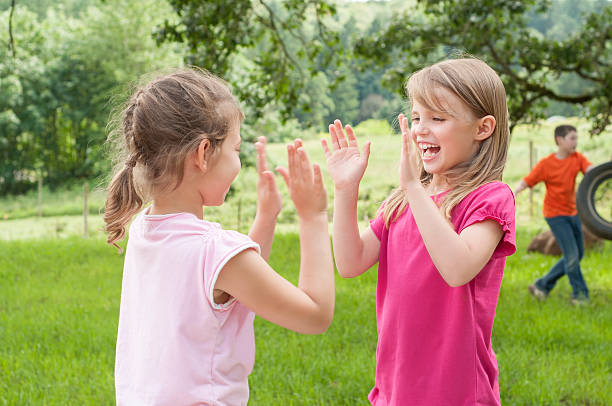 istock Two Girls Playing Patt-a-cake 174423295