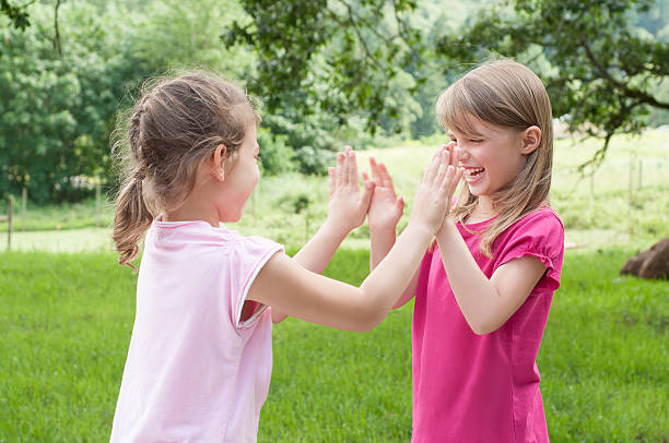 istock Two Girls Playing Patt-a-cake 174423297