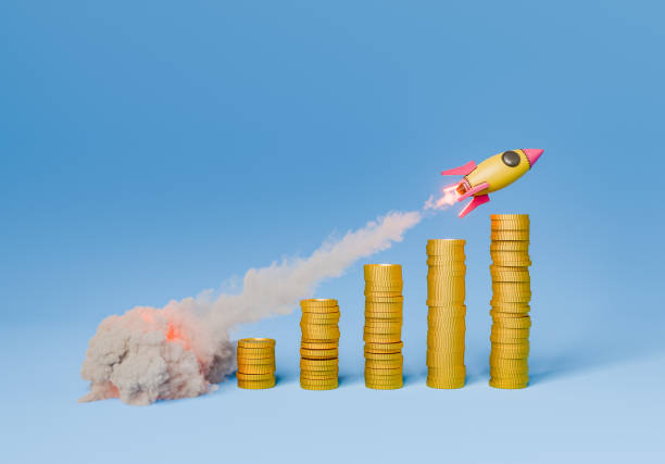 istock Rocket flying over the stacks of coins on blue background 1744243857