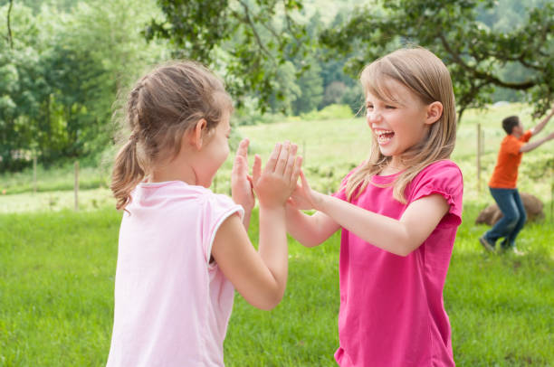 istock Two Girls Playing Patt-a-cake 174425210