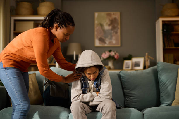 istock Mother comforting her son at home- teenage problems 1744255050