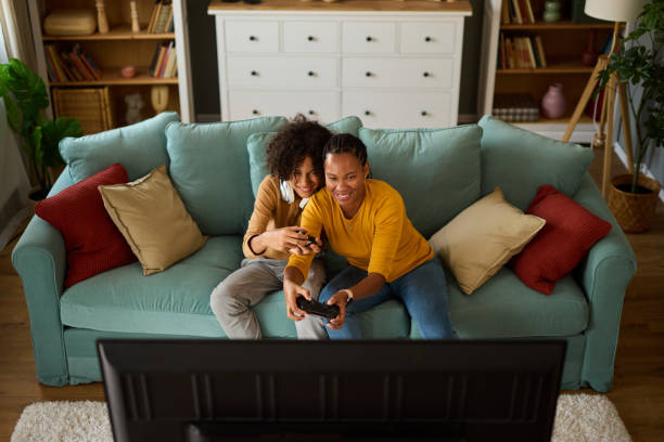 istock Mother and son playing video games at home 1744257287