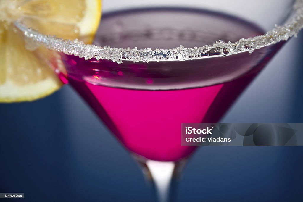 Martini with lemon Sugar coated pink martini with lemon Alcohol - Drink Stock Photo