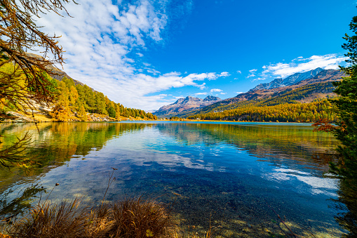 Lake Sils Maria, in the Engadine, photographed in autumn, with its landscape and the mountains above it.