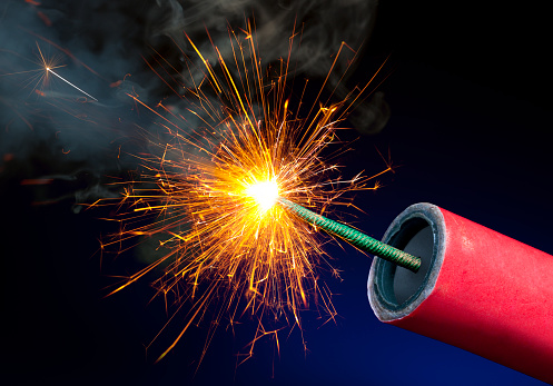 Fireworks or Explosives With Sparkling Lit Fuse