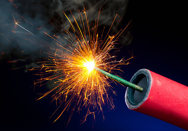 Fireworks or Explosives With Sparkling Lit Fuse Fireworks or Explosives With Sparkling Lit Fuse explosive photos stock pictures, royalty-free photos & images