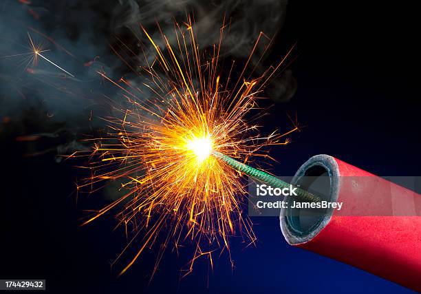 Fireworks Or Explosives With Sparkling Lit Fuse Stock Photo - Download Image Now - Firework - Explosive Material, Firework Display, Igniting