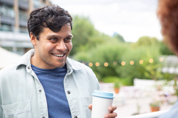 istock Young couple having a coffee and chatting in a city centre 1744306766