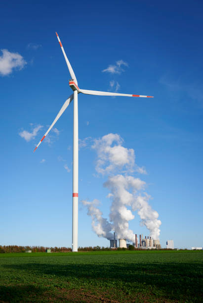 istock Wind turbine and coal fired power plant 1744311691