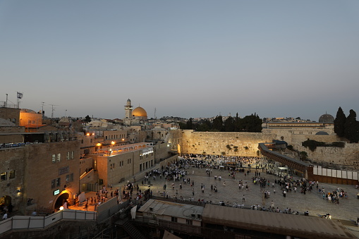 Wailing Wall Jewish prayers in Jerusalem Old City sunset