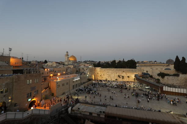 Wailing Wall Jewish prayers in Jerusalem Old City sunset stock photo
