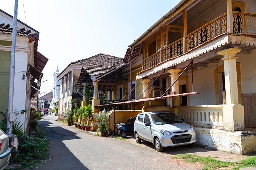 This image showcases the Latin Quarter of Goa, also known as Fontainhas, renowned for its Portuguese colonial architecture and vibrant streets. The area is a blend of narrow lanes, cobblestone streets, and colourful buildings, each with its unique design and character. Whether it's the ochre of a residence or the azure hue of a local shop, the vivid colours are a defining feature of this charming neighbourhood. The photograph aims to encapsulate the blend of cultures and histories that make up the Latin Quarter, offering viewers a snapshot of its atmospheric streets and architectural gems, all while capturing the essence of Goa's rich colonial past.
