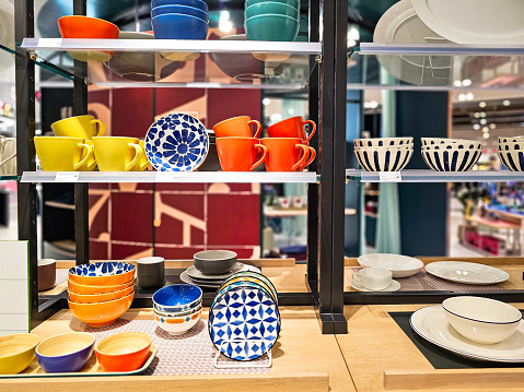 A collection of colorful crockery on display in the store.
