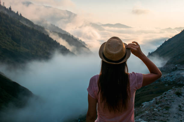istock woman in straw hat watching the view 1744330283
