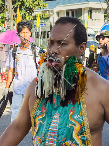 Phuket, Thailand - october 19: Unidentified participants in street procession ceremony at Hok Ong Tong Shrine, Phuket Vegetarian Festival in Phuket Town, Phuket, Thailand on the 19th October, 2023.