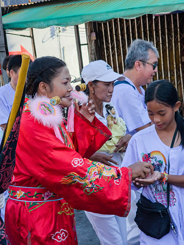Phuket, Thailand - october 19: Unidentified participants in street procession ceremony at Hok Ong Tong Shrine, Phuket Vegetarian Festival in Phuket Town, Phuket, Thailand on the 19th October, 2023.